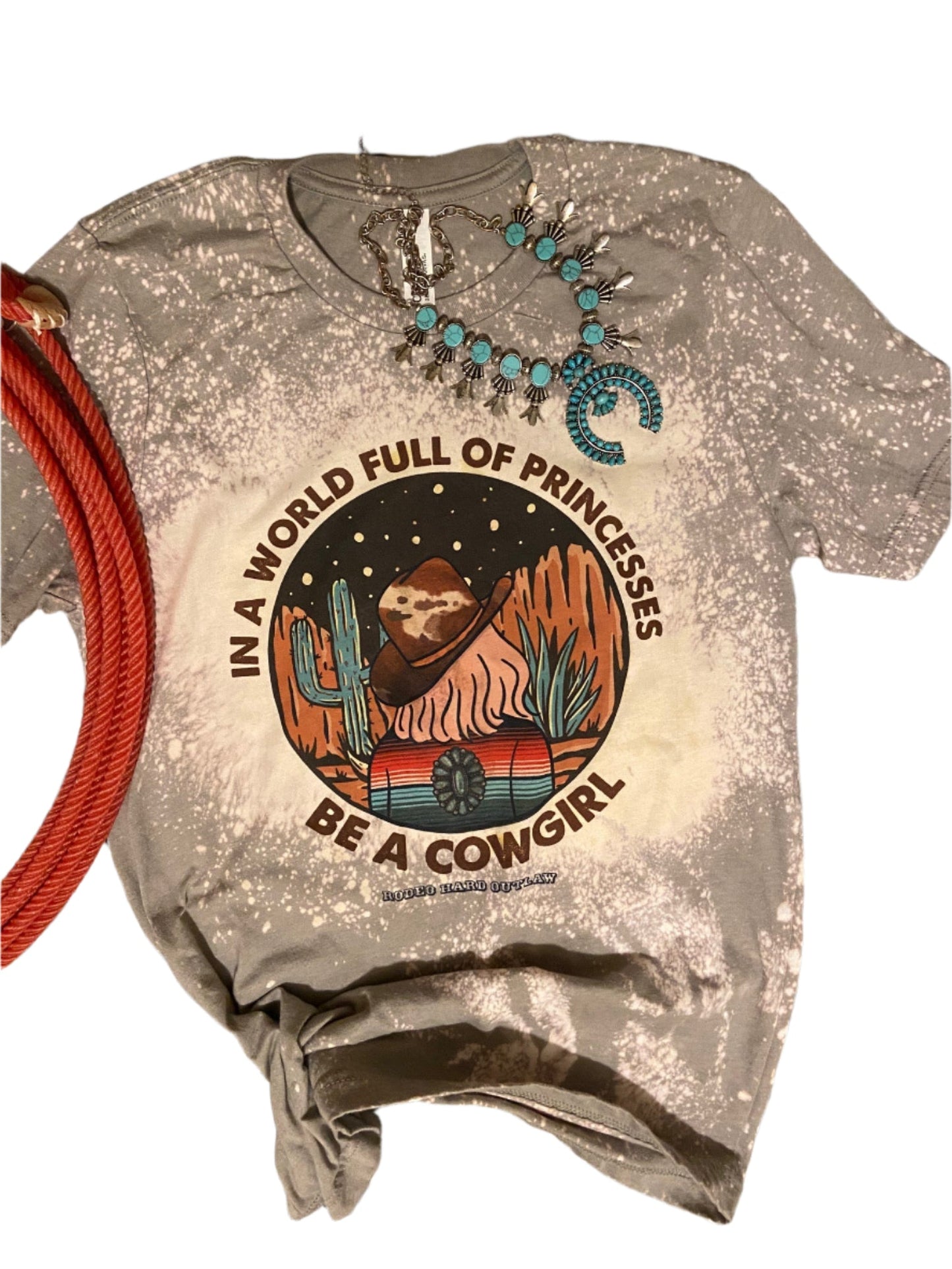 In a World Full of Princesses Be a Cowgirl T-Shirt | Western Graphic Tee | Rowdy Rowels