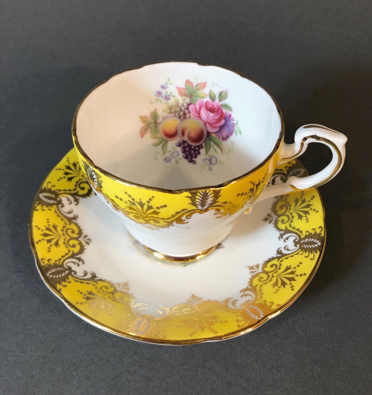 Tea Cup and Saucer by Paragon Made in England in Yellow, Gold, Pink