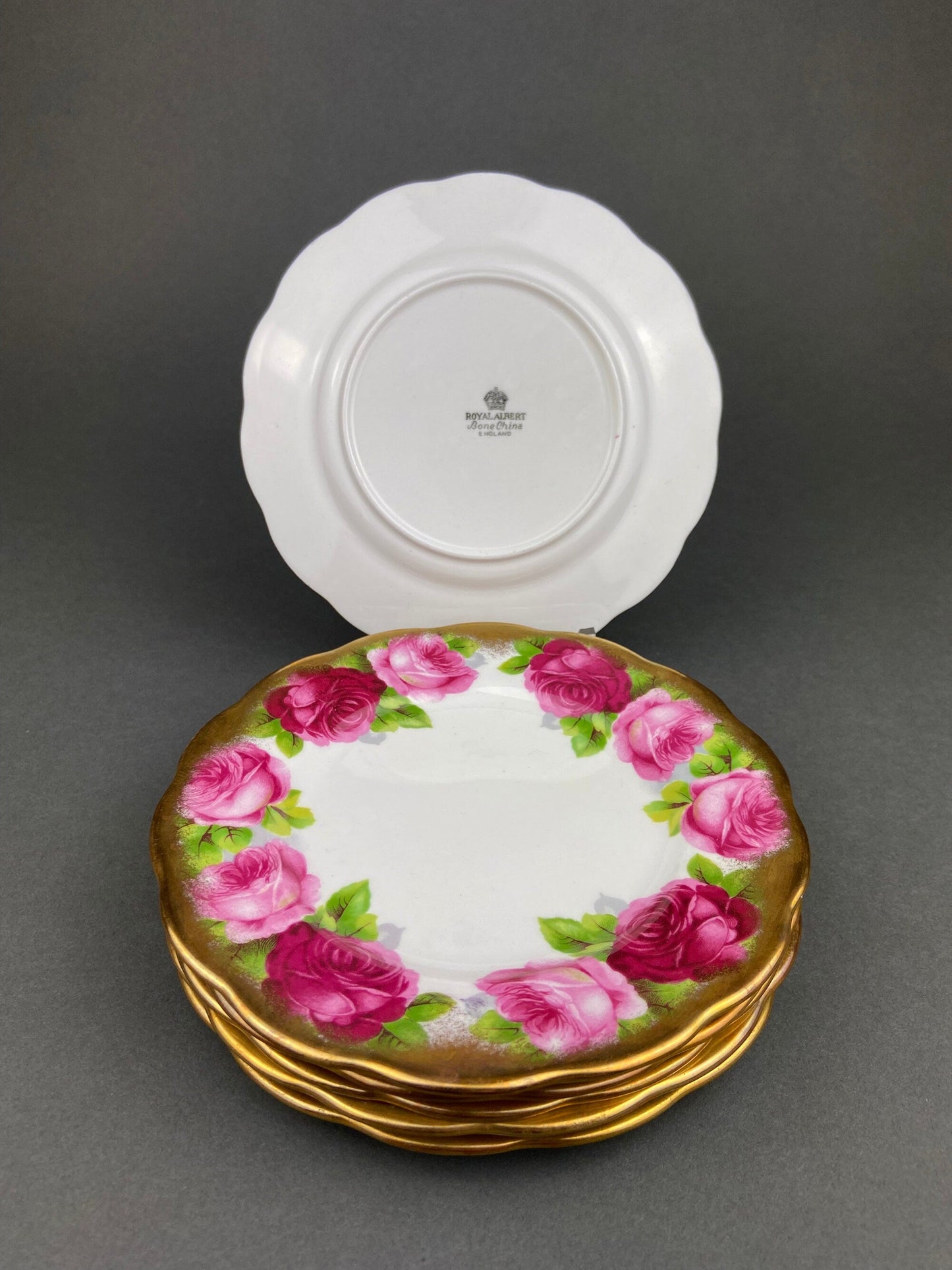 Royal Albert Set of Six Dessert Plates and One Serving Plate  with Old English Rose Pattern.  Made in England.