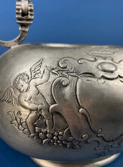 Pewter Teapot by Etain Zinn.  Etched with Heart and Cupids Antique Teapot. Spout Shaped like Eagle. Back Handle with Lion.