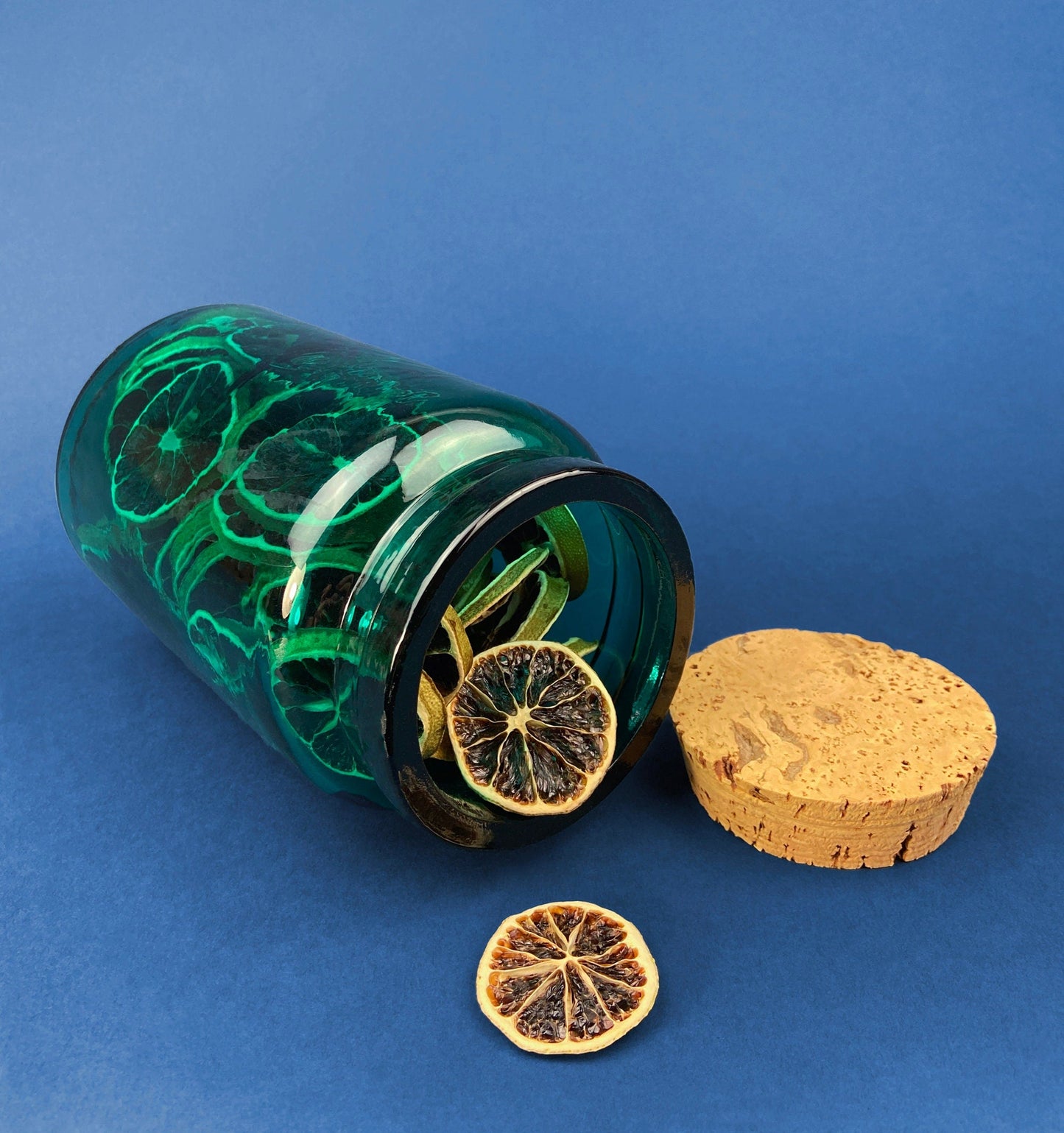 Green Glass Storage Jar with Dried  Orange Slices. Large, Deep Green Glass Canister with Cork Lid. Countertop Container.