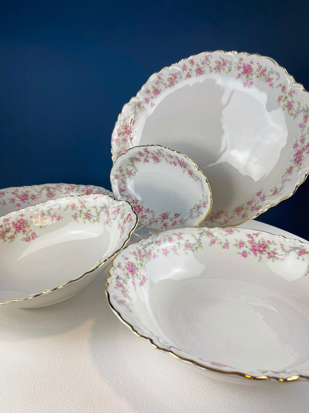 Antique Porcelain Serving Dishes. Set of Five Hutschenreuter Platters and Bowls with Pink Rose Garlands Motif.
