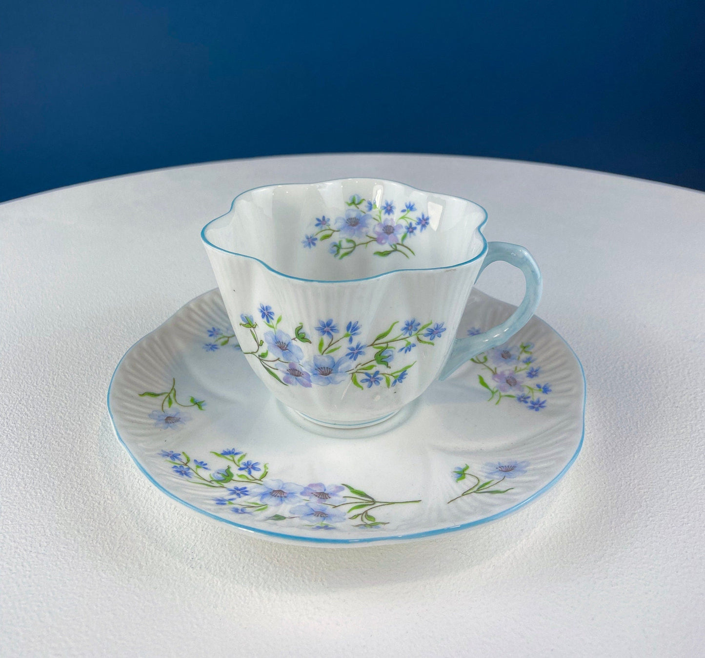 Antique Shelley Cup and Saucer with Begonia Motif . Beautiful, Fine Porcelain. Colorful Flowers and Blue Handle. French Country Living.