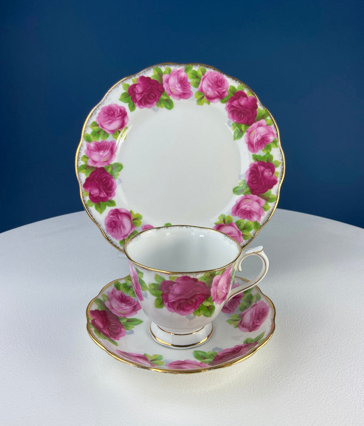 Black Cup and Saucer with Roses on White Background Inside the Cup. Royal Albert Old Country Rose Tea Set. Hand Painted Pink & Red Roses.