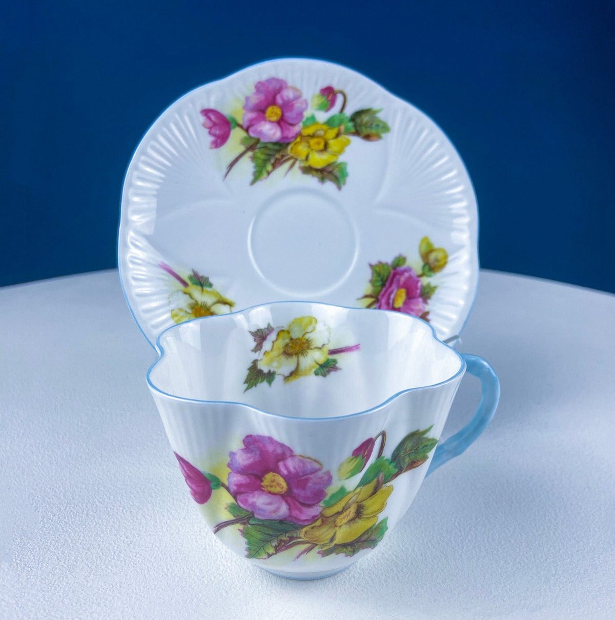 Antique Shelley Cup and Saucer with Begonia Motif . Beautiful, Fine Porcelain. Colorful Flowers and Blue Handle. French Country Living.