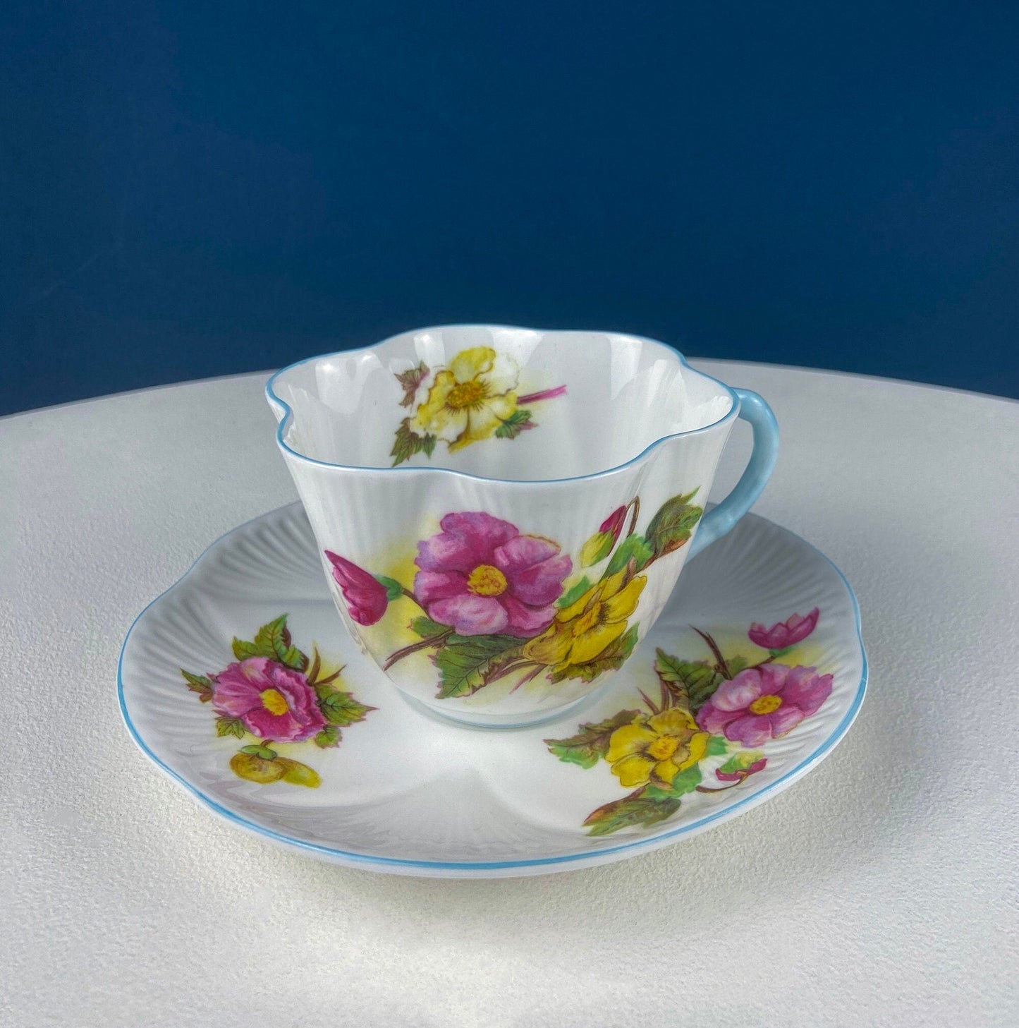 Antique Shelley Cup and Saucer with Begonia Motif . Beautiful, Fine Porcelain. Colorful Flowers and Blue Handle. French Country Living.