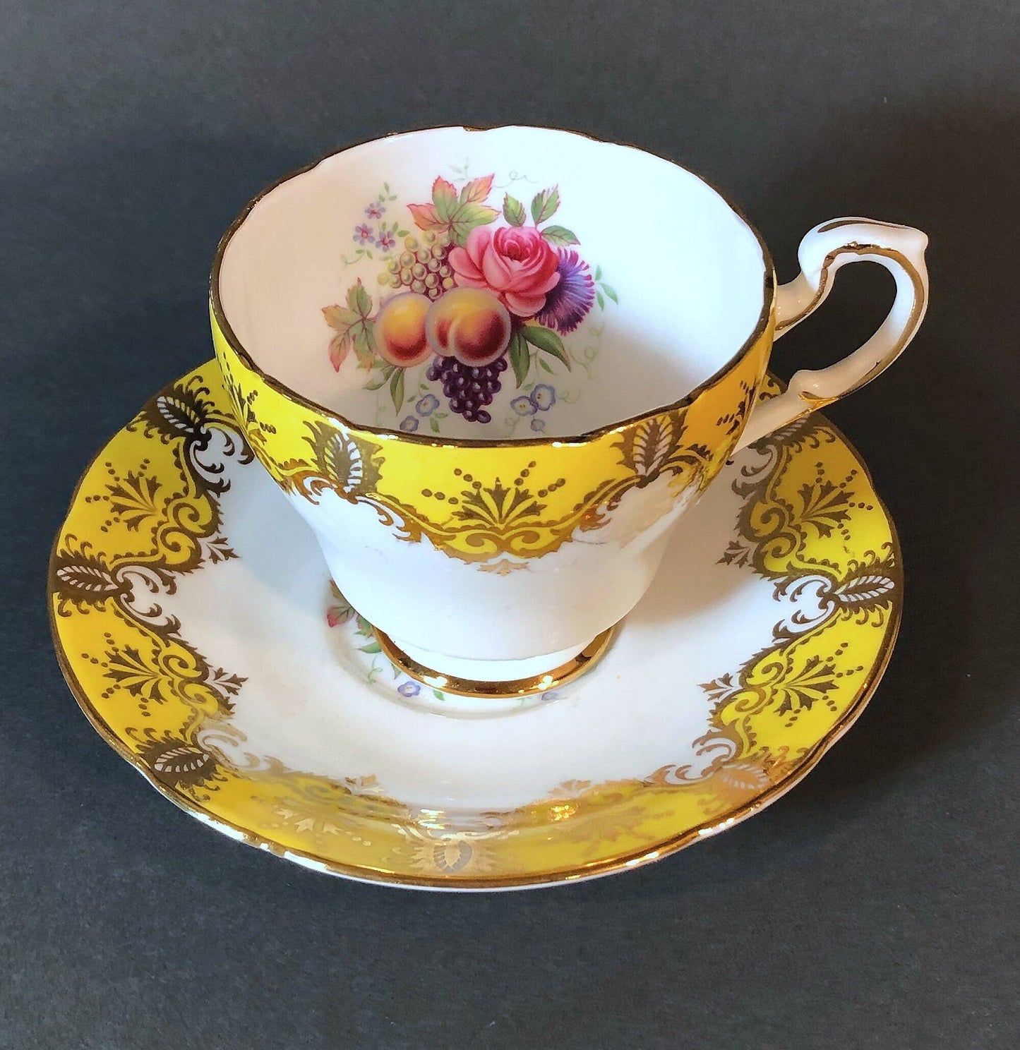 Tea Cup and Saucer by Paragon Made in England in Yellow, Gold, Pink