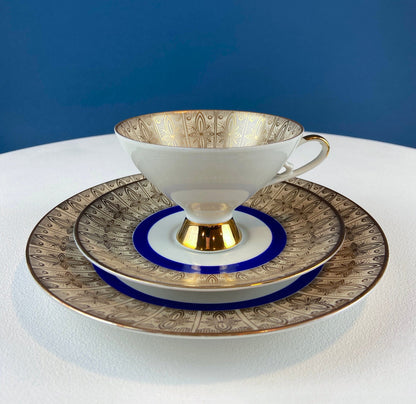 Antique Bavarian Porcelain Tea Trio. Z and Co, Tirschenreuther. Cup, Saucer, and Dessert Plate in Rich Gold and Blue. Modern Floral Pattern.